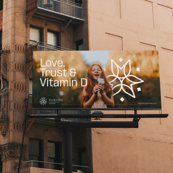Auburn Naturopathic Medicine billboard on a city building